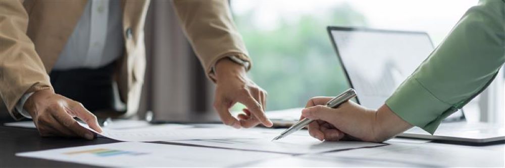 standing with laptop