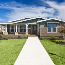 manufactured home with sidewalk